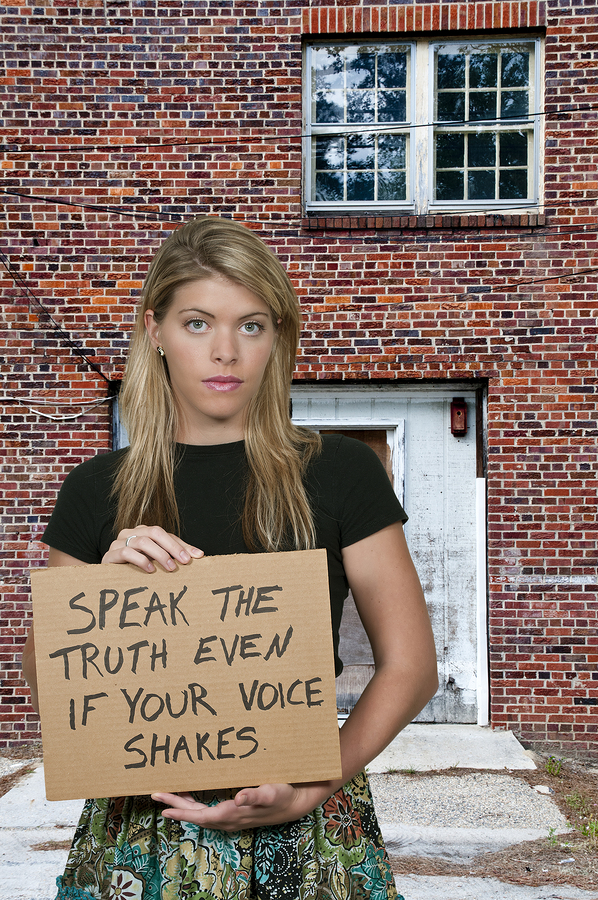 Woman Holding A Sign